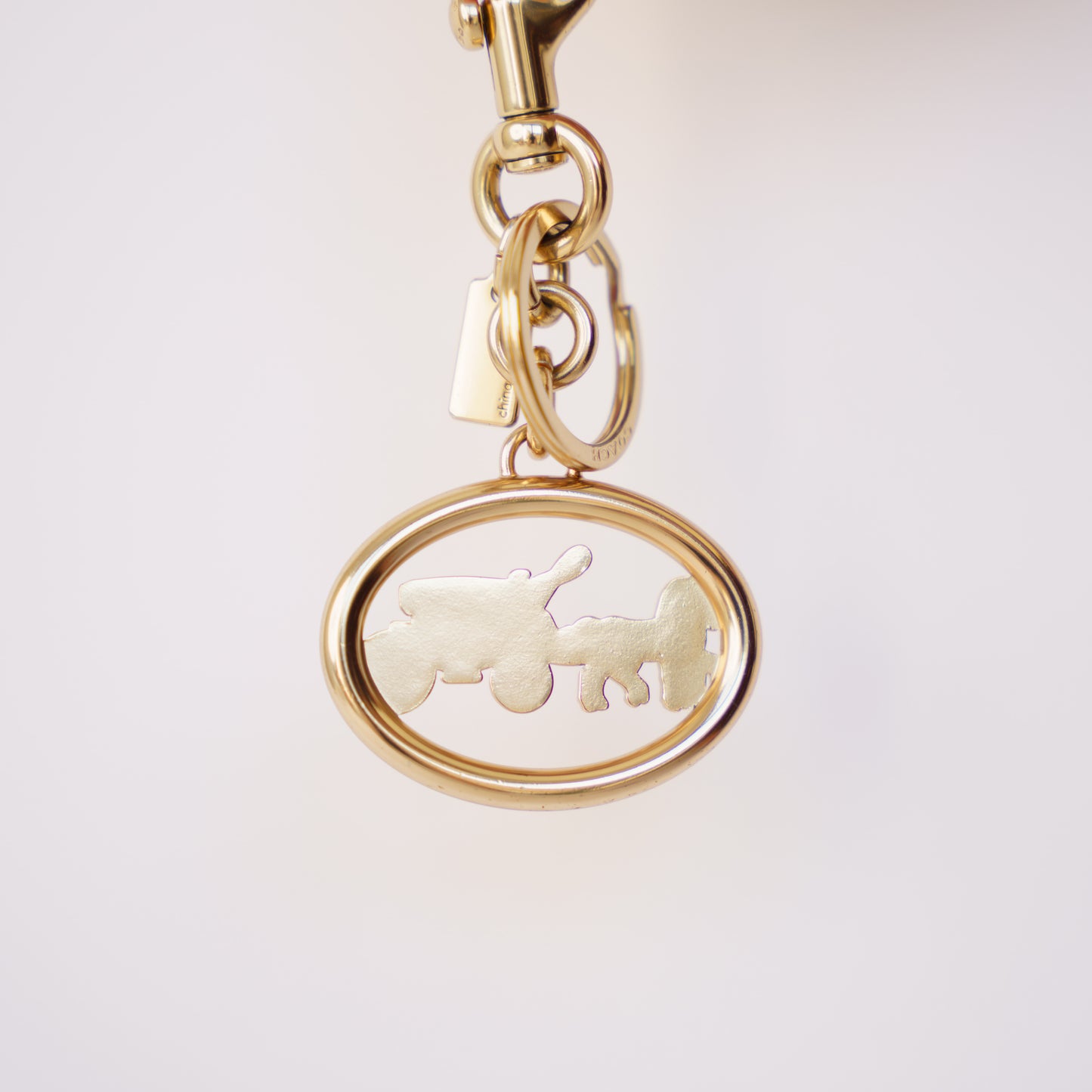 Coach Horse and Carriage Bag Charm in Gold Hardware 190326D24